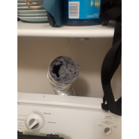 Clogged dryer vent prior to cleaning. 