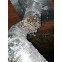 A damaged dryer vent inside a client's home. 